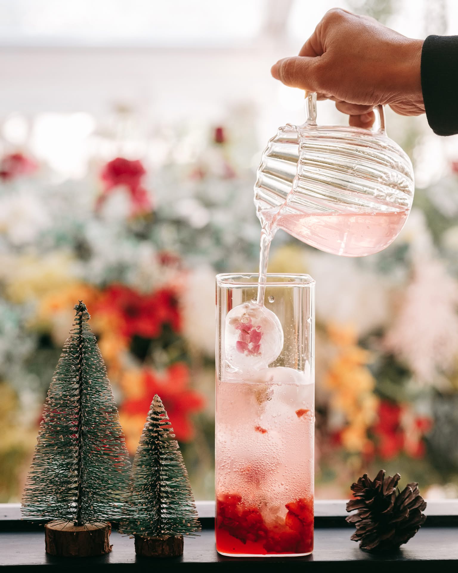 Ryoku seasonal pink refresher being poured over ice